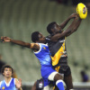 TIGER FLIES HIGH: An Imalu player takes a mark in front of his Brambuk opponent during Saturday's curtain-raiser at the MCG. Picture: SLATTERY MEDIA GROUP