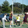 Mothers/Ring-ins vs Daughters Netball game action from Sunday. Note the skirt on Knuckles!!!