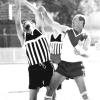Gerry O'Connor (Courthouse Eagles) and Brian Patterson (DML Crushers) in a contest in the TAFL's first Grand Final.  Dated 01/09/1997, courtesy of the Northern Daily Leader.
