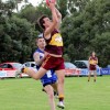 Mount Compass' Jake Harris takes a strong mark in front of a Victor Harbor defender