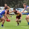 Mount Compass forward Ben Mundy tries to steal the ball for Victor Harbor's Tarquin Brown