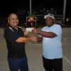 Sandy Alfred congratulates Johnny for winning a $50 free throw contest.