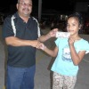 Sandy Alfred recognizes Majuro Middle School 8th grader Julie Bobo for winning a $50 free throw contest.