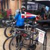 Carol Williams holds the Burgee on a bike trip to Bright