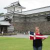 Elizabeth Johnston holding the burgee at Kanazawa Castle, Japan