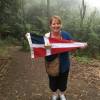 Elizabeth Johnston holds the burgee after completing the 1,000 Steps in Victoria's Dandenong Ranges
