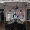 David Wallace holds the burgee on HMS Gannet at Chatham Dockyards, UK