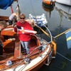 Anna Farr showing off the burgee after racing wooden boats in Råssö Sweden