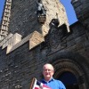 David (Daffy) Wallace holds the burgee in front of the Wallace Monument in Edinburgh, Scotland, UK 