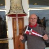 David (Daffy) Wallace holds the burgee on the deck of the Royal Yacht Britannia in Leith Port, Edinburgh, Scotland, UK — in Leith.