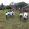 Children learning to pass in a competitive game