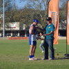 Col Daye receives his premiership medal from David Crough of Essential Energy