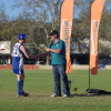 Troy Fergusion receives his premiership medal from David Crough of Essential Energy