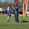 Carl Frazier receives his premiership medal from David Crough of Essential Energy