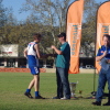 Alex Hudson receives his premiership medal from David Crough of Essential Energy