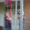 Graham Lewis raise the premiership flag