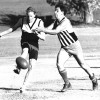 Anthony Hupfield of the Black and Blues and gets a kick away under pressure from Tamworth's John Hanlin.  Dated 28/02/1991, courtesy of the Northern Daily Leader.