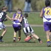 Luke Hartley (#15) applies pressure to spill a ball