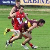 Mount Compass midfielder Michael Corbett under pressure from his Strathalbyn opponent at Mount Compass Oval last Saturday (May 24)