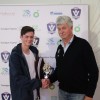 Ewen Williams from Combined Saints is presented with the Under-16 best-and-fairest award by AFL Gippsland Commission Chair Brian Quigley