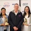 17 and under best and fairest Faith Biddle from Maffra, TRFM Gippsland League board member Terry Flynn and 17 and under best and fairest runner-up Taylah Brown from Leongatha