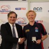 Paul Carter, son of Tom Carter, presents the Shaw-Carter Medal to under-16 best and fairest Ben McKinnon from Bairnsdale