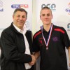 TRFM Gippsland League board chair Greg Maidment and Wilkinson medallist for under-18 best and fairest Hudson Holmes of Maffra