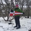 Anne Smith holds the Burgee at 5,500', Christmas Hill on Michael's Birthday, Mt Hotham.