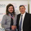 Reserves Hartley Medal winner Nicholas Tucker of Wonthaggi Power with TRFM Gippsland League chair Greg Maidment
