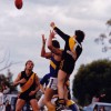 Allan Jennings punches the ball away from his opponent
