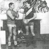 Tom Hafey with Titch Hore in front of the fireplace in the change Rooms August 1989